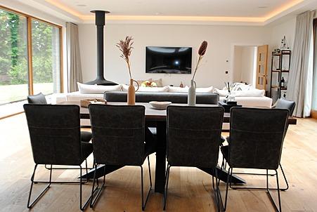 The open plan living area includes a bright dining space.