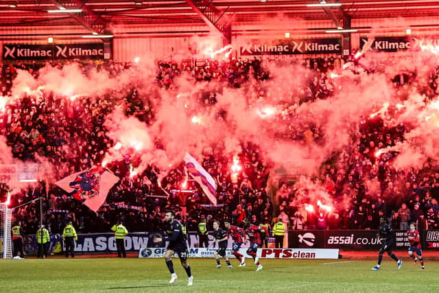 Rangers fans light up the Bob Shankly stand with pyro during Wednesday's  match against Dundee at Dens Park (Picture: Rob Casey / SNS Group)