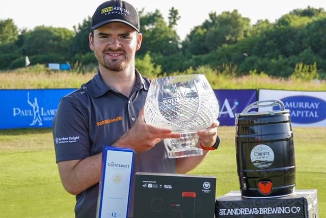 Craig Lawrie shows off the trophy after his two-shot win in the Farmfoods Scottish Par 3 Championship. Picture: Tartan Pro Tour