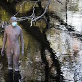 One of artist Antony Gormley's "6 TIMES" statues wears a protective face mask as the UK continues lockdown, with the Scottish Government asking for ideas on how to ease the restrictions.