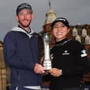 Paul Cormack and Lydia Ko show off the trophy after the Kiwi's win in the AIG Women's Open over the Old Course at St Andrews. Picture: Oisin Keniry/R&A/R&A via Getty Images.