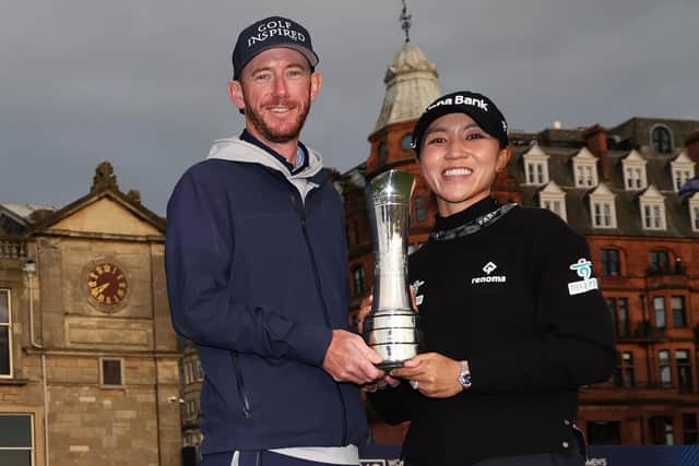 Paul Cormack and Lydia Ko show off the trophy after the Kiwi's win in the AIG Women's Open over the Old Course at St Andrews. Picture: Oisin Keniry/R&A/R&A via Getty Images.