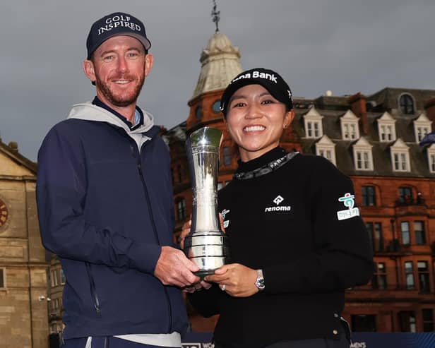 Paul Cormack and Lydia Ko show off the trophy after the Kiwi's win in the AIG Women's Open over the Old Course at St Andrews. Picture: Oisin Keniry/R&A/R&A via Getty Images.
