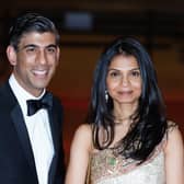 Chancellor of the Exchequer Rishi Sunak alongside his wife Akshata Murthy. PIC: Ian West/PA.