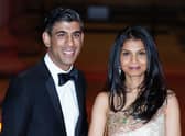 Chancellor of the Exchequer Rishi Sunak alongside his wife Akshata Murthy. PIC: Ian West/PA.