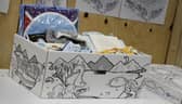 The baby boxes given to Scotland's new mothers contain a mattress, fitted sheet and blanket, clothes from newborn up to the age of 6 months, a bath towel, a travel changing mat, muslin cloth squares and a bib (Picture: Scottish Government/PA)