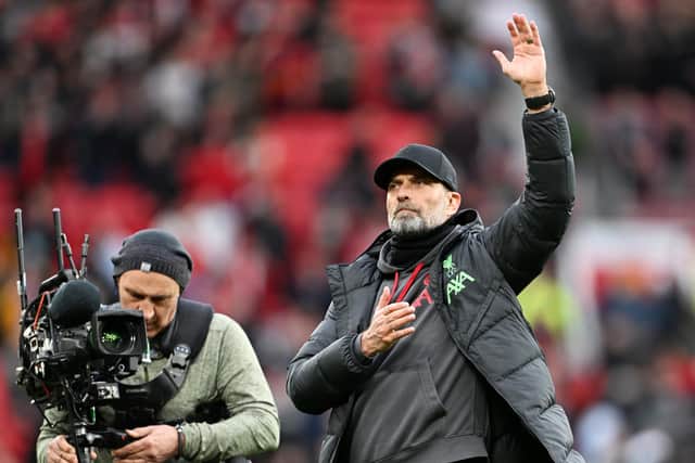 Jurgen Klopp salutes the Liverpool players at full time.
