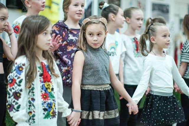 Refugee children from Ukraine perform aboard the MS Victoria ship in Leith, where many families fleeing the war lived after arriving in Scotland. Picture: Getty Images