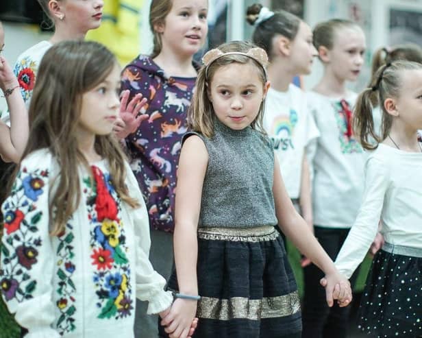 Refugee children from Ukraine perform aboard the MS Victoria ship in Leith, where many families fleeing the war lived after arriving in Scotland. Picture: Getty Images