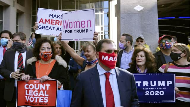 Supporters of President Donald Trump demonstrate outside the Pennsylvania Convention Center where votes are being counted.