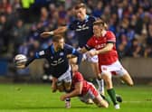 Finn Russell of Scotland passes the ball out the back of his hand during the Six Nations Rugby match between Scotland and Wales at Murrayfield Stadium.