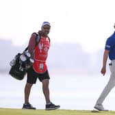 Grant Forrest and his caddie Davy Kenny walk on the 18th green during day three of the Abu Dhabi HSBC Championship at Yas Links. Picture: Ross Kinnaird/Getty Images.