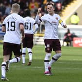 Hearts' Alex Cochrane is told to get back on the pitch by captain Lawrence Shankland after mistakingly thinking he was substituted during the 2-0 defeat to Motherwell. (Photo by Rob Casey / SNS Group)