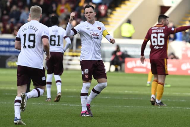 Hearts' Alex Cochrane is told to get back on the pitch by captain Lawrence Shankland after mistakingly thinking he was substituted during the 2-0 defeat to Motherwell. (Photo by Rob Casey / SNS Group)