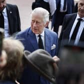 King Charles III greets supporters during an impromptu walkabout on the Mall