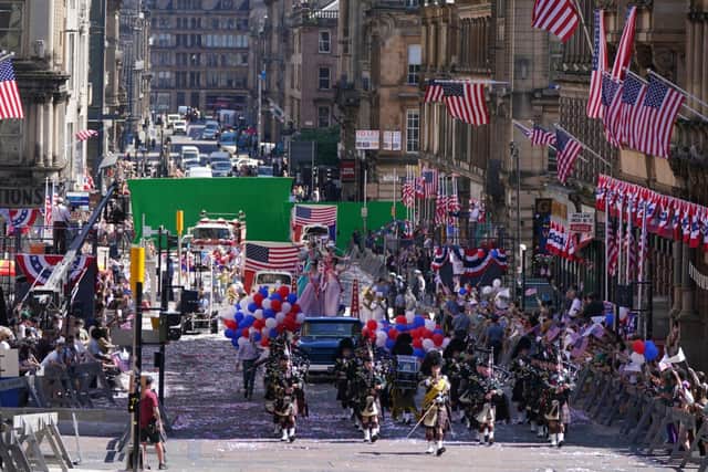 Cast take part in a parade scene on St Vincent Street in Glasgow, during filming for what is thought to be the new Indiana Jones 5 movie starring Harrison Ford picture: Andrew Milligan/PA