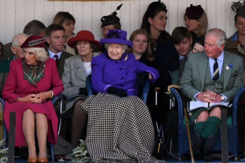 Queen Elizabeth II, Camilla, Duchess of Cornwall and Prince Charles look on during the annual Braemar Gathering in Braemar on September 7, 2019.