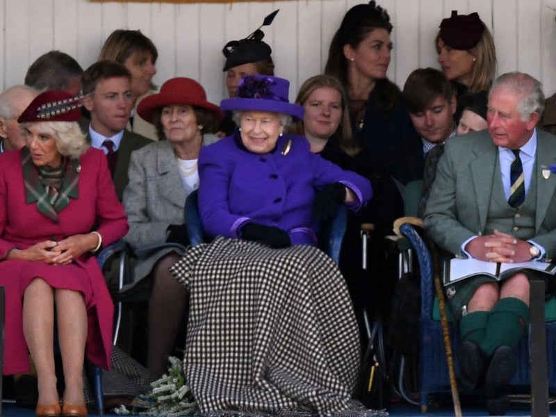 Queen Elizabeth II, Camilla, Duchess of Cornwall and Prince Charles look on during the annual Braemar Gathering in Braemar on September 7, 2019.
