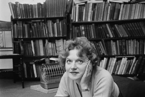 Scottish-born novelist Muriel Spark making notes while lying on the floor (Photo: Evening Standard/Hulton Archive/Getty Images)
