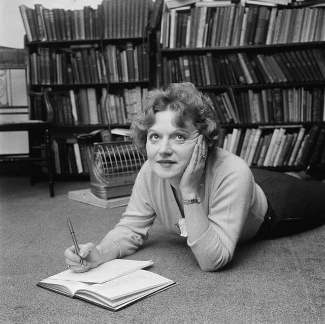 Scottish-born novelist Muriel Spark making notes while lying on the floor (Photo: Evening Standard/Hulton Archive/Getty Images)