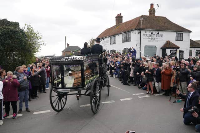 The funeral cortege of Paul O'Grady travels through the village of Aldington, Kent ahead of his funeral at St Rumwold's Church. Picture: Yui Mok/PA Wire