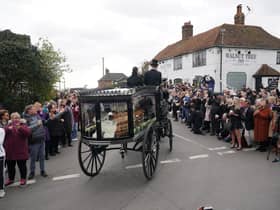 The funeral cortege of Paul O'Grady travels through the village of Aldington, Kent ahead of his funeral at St Rumwold's Church. Picture: Yui Mok/PA Wire