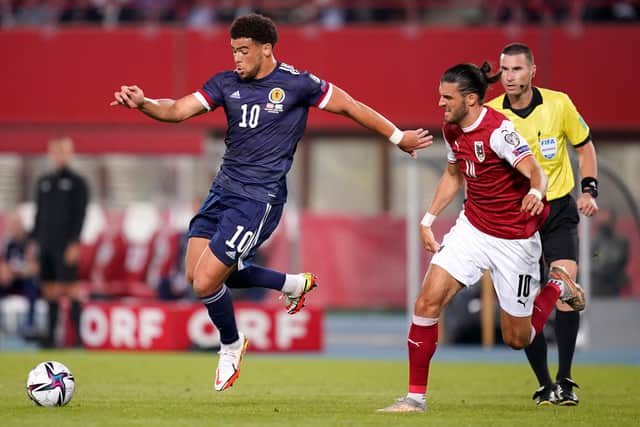 Che Adams of Scotland battles for possession with Florian Grillitsch of Austria.