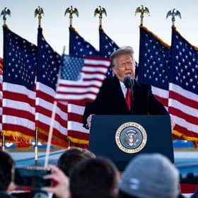 Donald Trump speaks to supporters at Joint Base Andrews before boarding Air Force One for his last time as US president on 20 January 2021. (Pic: Getty Images)