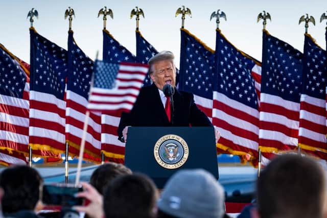 Donald Trump speaks to supporters at Joint Base Andrews before boarding Air Force One for his last time as US president on 20 January 2021. (Pic: Getty Images)