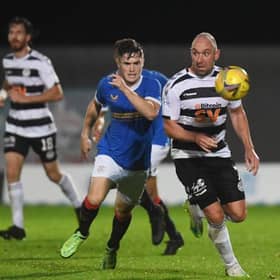 Ayr United's Michael Moffat (right) competes with Robbe Ure during an SPFL Trust Trophy match between Rangers B and Ay United at the C&G Systems Stadium on September 14, 2021, in Dumbarton, Scotland.  (Photo by Craig Foy / SNS Group)