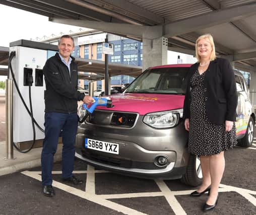 Transport Secretary Michael Matheson officially opening the Falkirk Stadium charging hub with Falkirk Council leader Cecil Meiklejohn last August