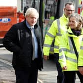 Prime Minister Boris Johnson visits Bewdley in Worcestershire to see recovery efforts following recent flooding in the Severn valley.