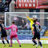 Luke McCowan's (L) chip evades Hearts goalkeeper Zander Clark to give Dundee the three points at Dens Park (Photo by Mark Scates / SNS Group)
