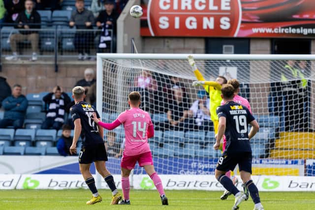 Luke McCowan's (L) chip evades Hearts goalkeeper Zander Clark to give Dundee the three points at Dens Park (Photo by Mark Scates / SNS Group)