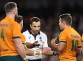 Referee Mathieu Raynal speaks to Nic White and Bernard Foley of the Wallabies during the Bledisloe Cup match with New Zealand in Melbourne in September. (Photo by Cameron Spencer/Getty Images)
