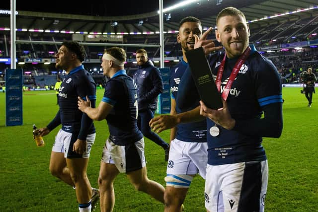 Finn Russell with his man of the match award after the win over Argentina. (Photo by Craig Williamson / SNS Group)