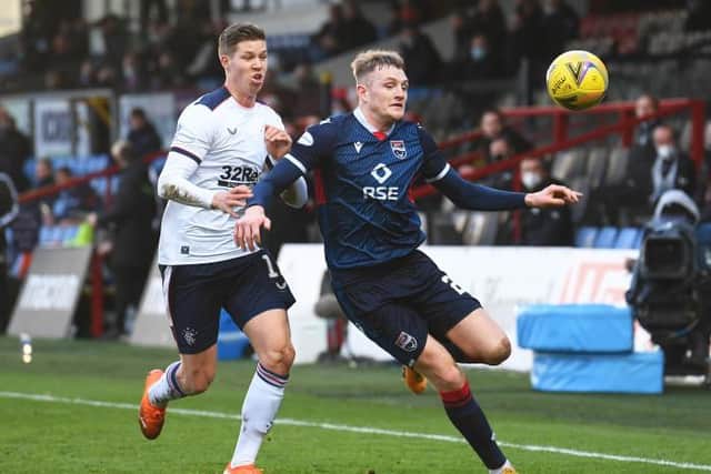 Ross County's Coll Donaldson competes with Cedric Itten during the Scottish Premiership match between Ross County and Rangers at the Global Energy Stadium on December 06, 2020, in Dingwall, Scotland. (Photo by Craig Foy / SNS Group)