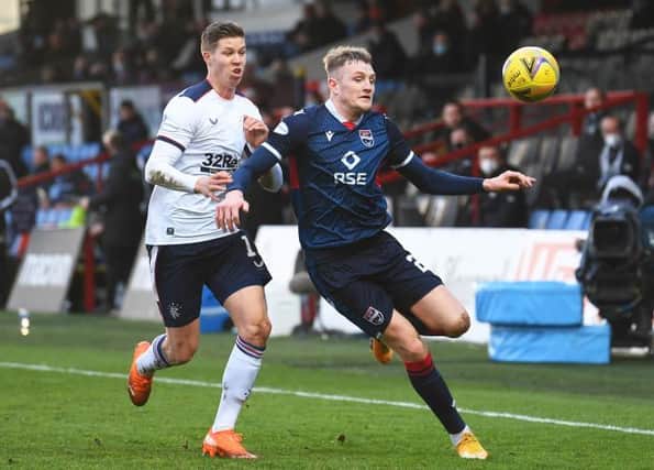 Ross County's Coll Donaldson competes with Cedric Itten during the Scottish Premiership match between Ross County and Rangers at the Global Energy Stadium on December 06, 2020, in Dingwall, Scotland. (Photo by Craig Foy / SNS Group)