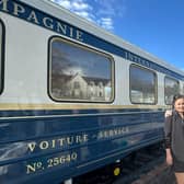 Isara, Fergus and Mia McCallum beside the carriage in the Pitlochry Station car park. (Photo by The Wee Choo-Choo)