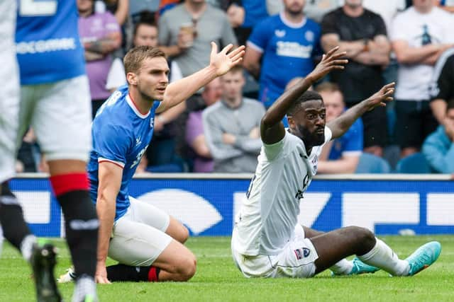 Ross County felt Rangers defender James Sands should have been sent off for this tangle with Jordy Hiwula.