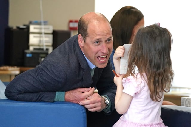 The Duke of Cambridge speaks to Olivia Wilson, two, at the Wheatley Group in Glasgow.