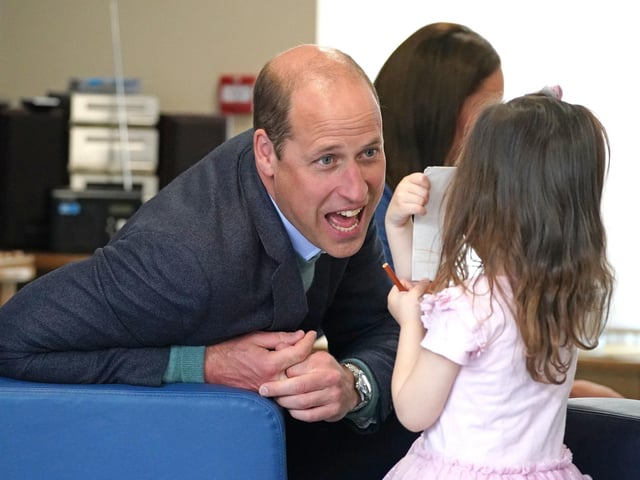 The Duke of Cambridge speaks to Olivia Wilson, two, at the Wheatley Group in Glasgow.