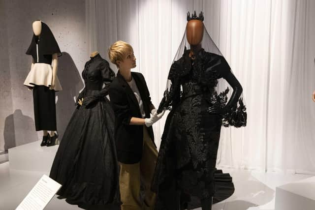 Curator Georgina Ripley puts the finishing touches to Beyond the Little Black Dress at the National Museum of Scotland PIC: Duncan McGlynn