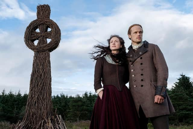 Caitriona Balfe as Claire Randall and Sam Heughan as Jamie Fraser from Outlander. A church connected to the series has gone up for sale. Picture: Starz!/Kobal/Shutterstock