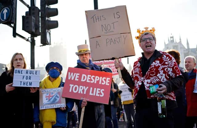 Demonstrators protest near the House of Commons during Prime Minister's Questions last week (Picture: Getty)