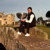 Danny Willett poses with the trophy on the Swilcan Bridge at St Andrews after winning the 20th Alfred Dunhill Links Championship. Picture:  Matthew Lewis/Getty Images.