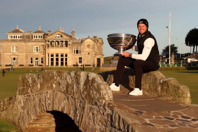 Danny Willett poses with the trophy on the Swilcan Bridge at St Andrews after winning the 20th Alfred Dunhill Links Championship. Picture: Matthew Lewis/Getty Images.