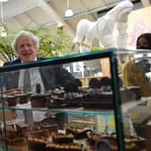 Boris Johnson eyes up a display of cakes and desserts on a trip to Truro (Picture: Justin Tallis/WPA pool/Getty Images)