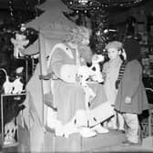 Children meet Santa Claus in Jenners in December 1958.