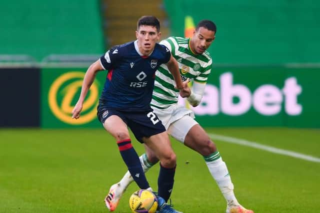 Ross County's Ross Stewart (L) holds off Celtic's Christopher Jullien during a Betfred Cup match between Celtic and Ross County at Celtic Park on November 29, 2020, in Glasgow, Scotland. (Photo by Craig Foy / SNS Group)